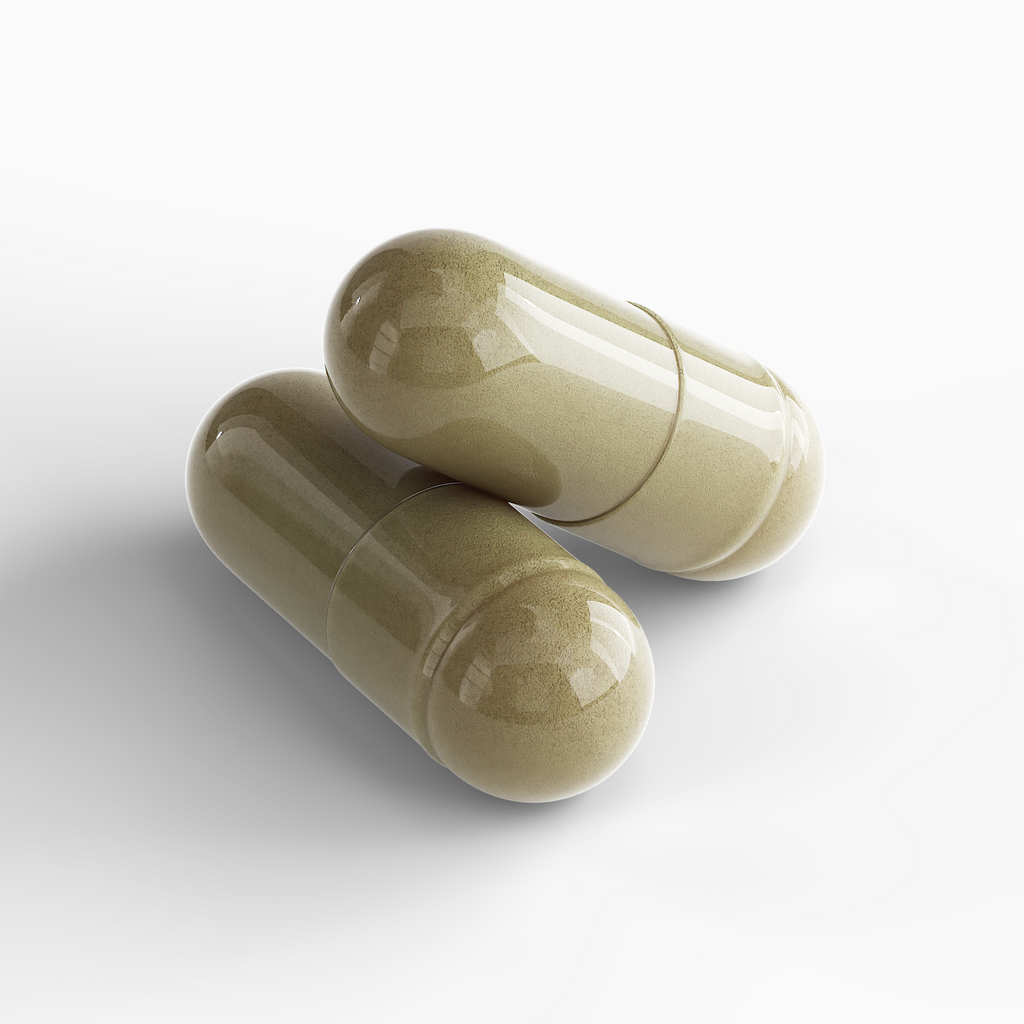 Close-up of two Women's Vitality Formula herbal capsules