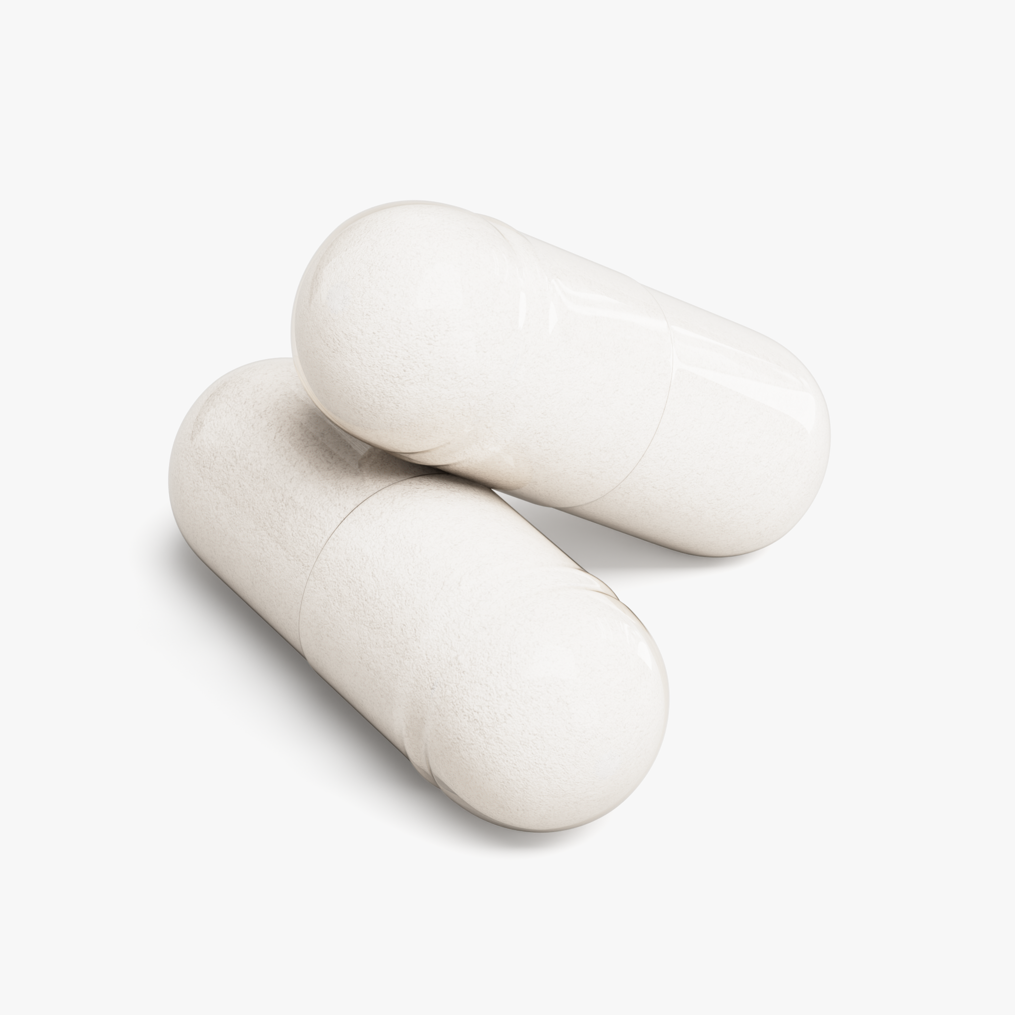 Close-up of two Magnesium Glycinate capsules